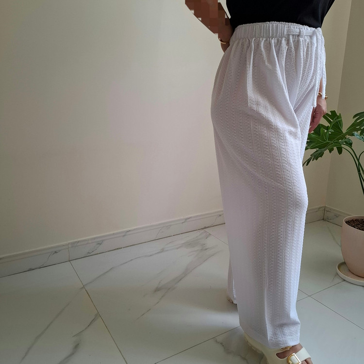 نمای نیم رخ شلوار بگ راحتی زنانه سفید سایز بزرگ