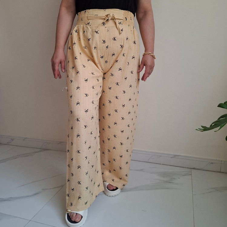 شلوار راحتی زنانه نخی طرح CK نقرهکوب رنگ نخودی روشن مناسب تا سایز 50