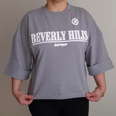 تیشرت زنانه نخ پنبه باکسی طرح Beverly Hills رنگ طوسی مناسب تا سایز 46